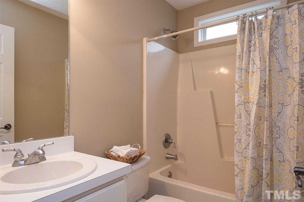 3809 Toyon Drive Raleigh, NC 27616 - Photo 17 of 20 a bathroom with a sink and a bathtub