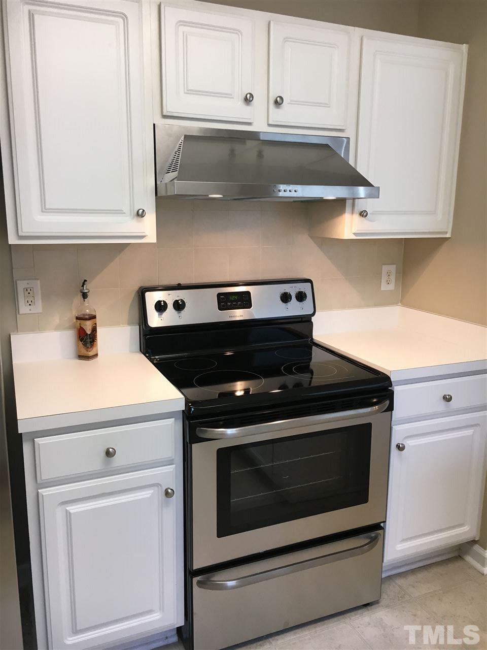 3809 Toyon Drive Raleigh, NC 27616 - Photo 8 of 20 a stove top oven sitting inside of a kitchen