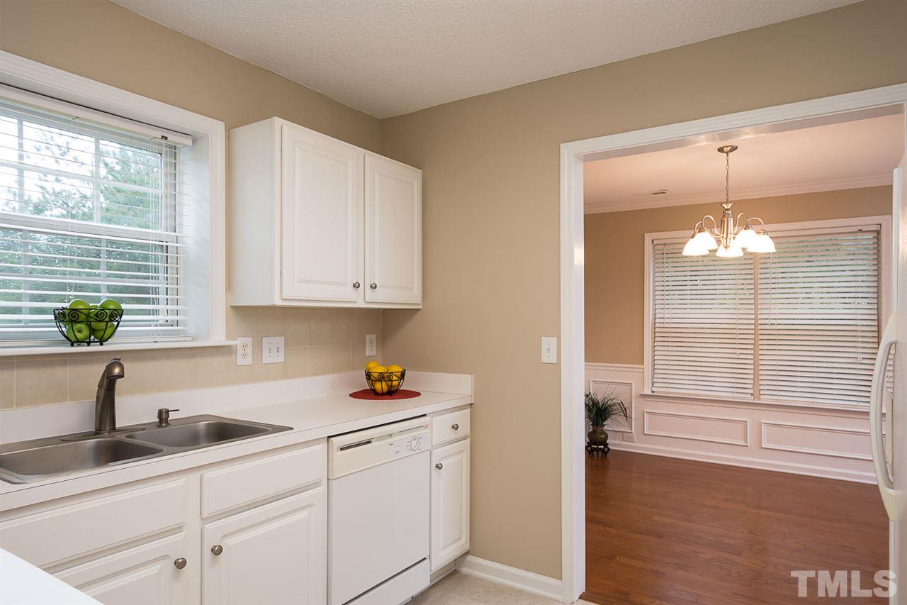 3809 Toyon Drive Raleigh, NC 27616 - Photo 9 of 20 a kitchen with a sink and cabinets