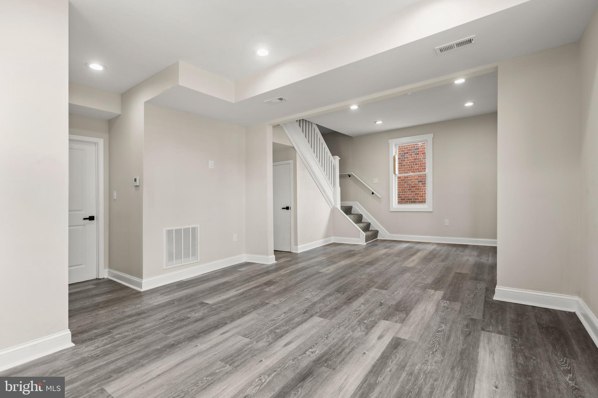 505 McCabe Avenue Baltimore, MD 21212 - Photo 11 of 46 a view of empty room with wooden floor and window