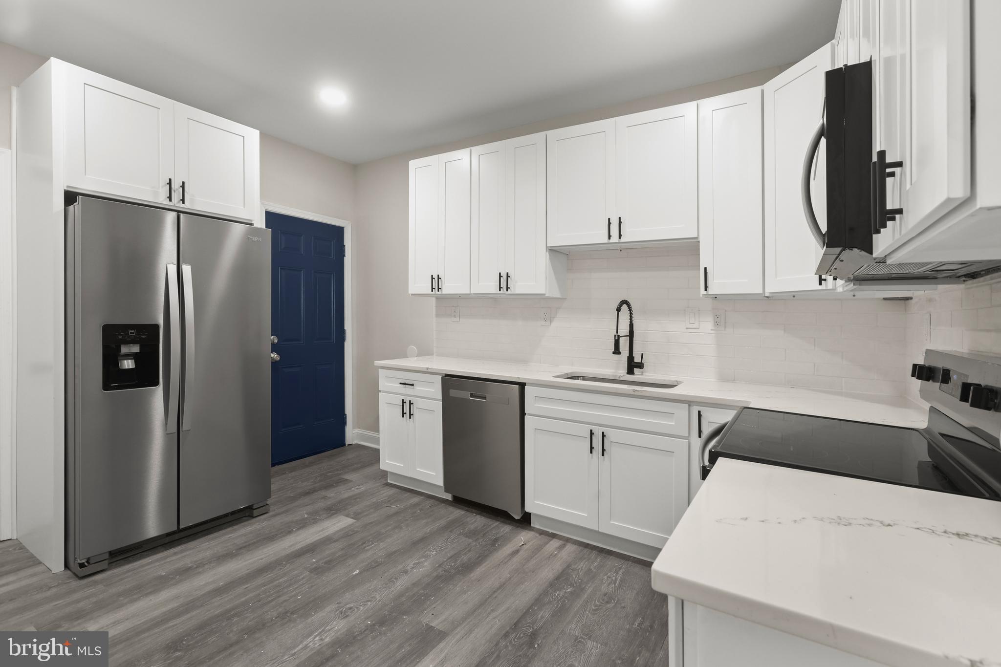 505 McCabe Avenue Baltimore, MD 21212 - Photo 17 of 46 a kitchen with stainless steel appliances a refrigerator sink and cabinets
