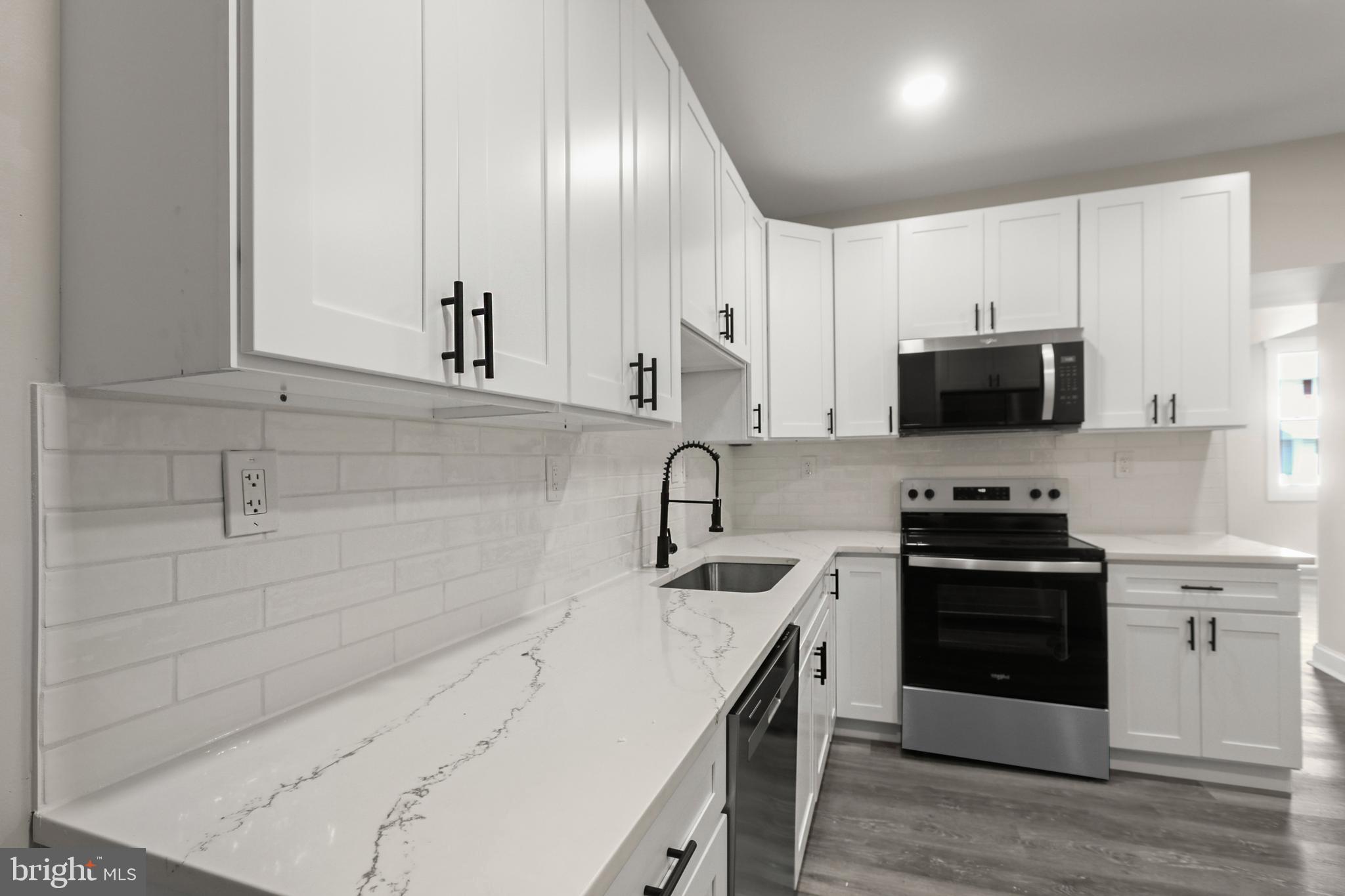 505 McCabe Avenue Baltimore, MD 21212 - Photo 19 of 46 a kitchen with appliances a sink and cabinets