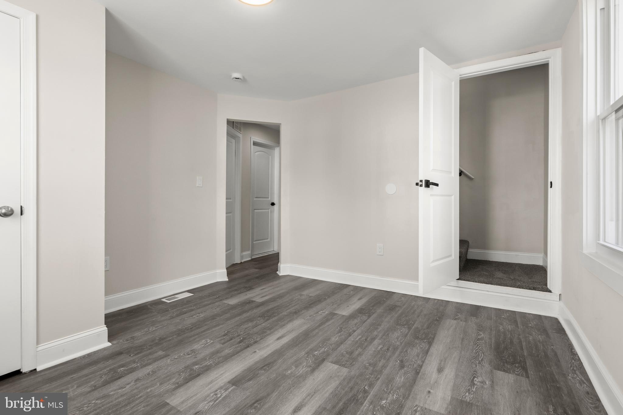 505 McCabe Avenue Baltimore, MD 21212 - Photo 24 of 46 a view of an empty room with wooden floor