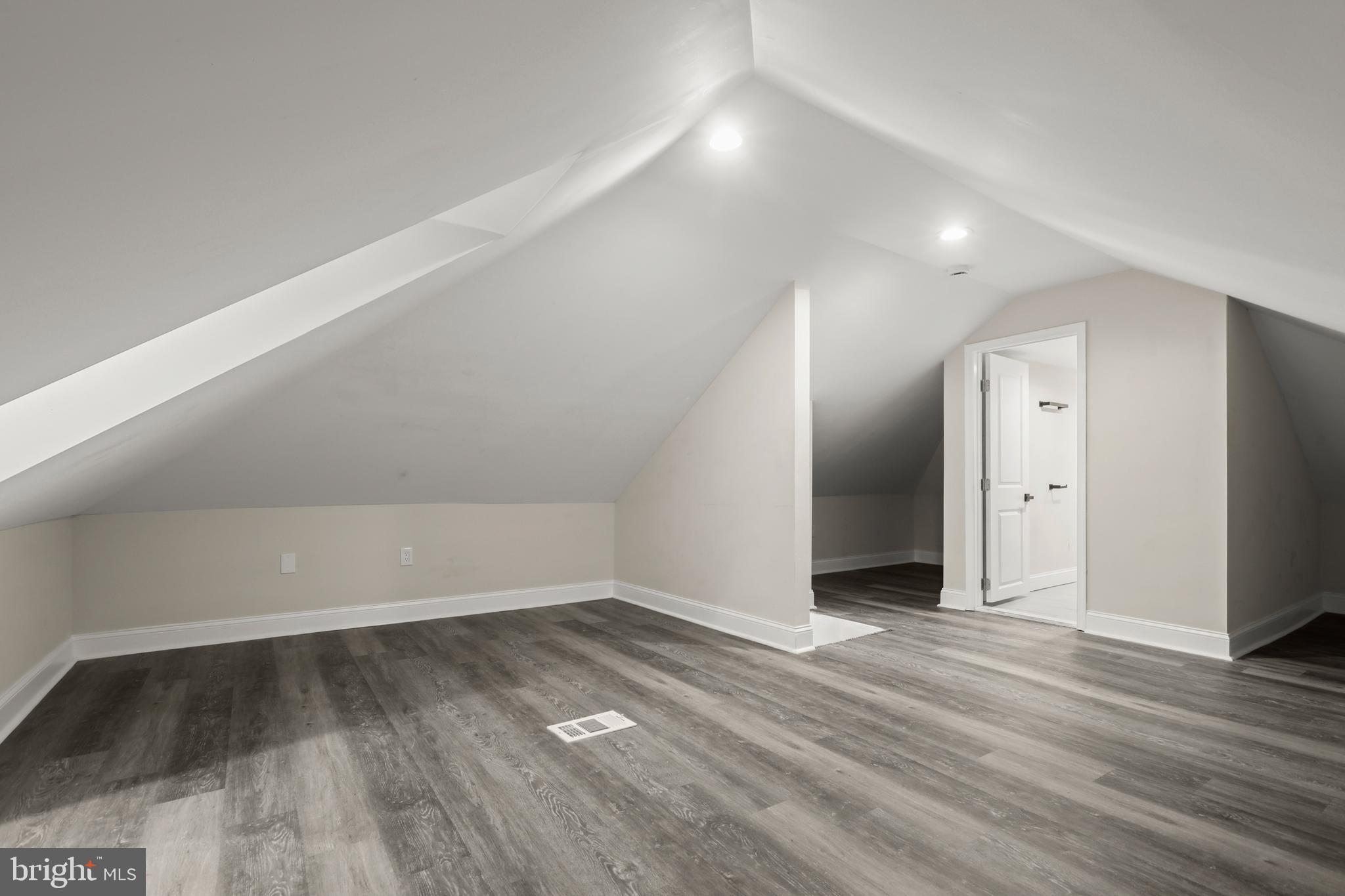 505 McCabe Avenue Baltimore, MD 21212 - Photo 35 of 46 an empty room with wooden floor and windows