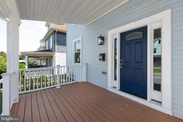 a view of a house with wooden deck