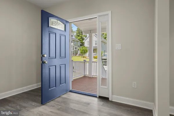 a view of front door with wooden floor