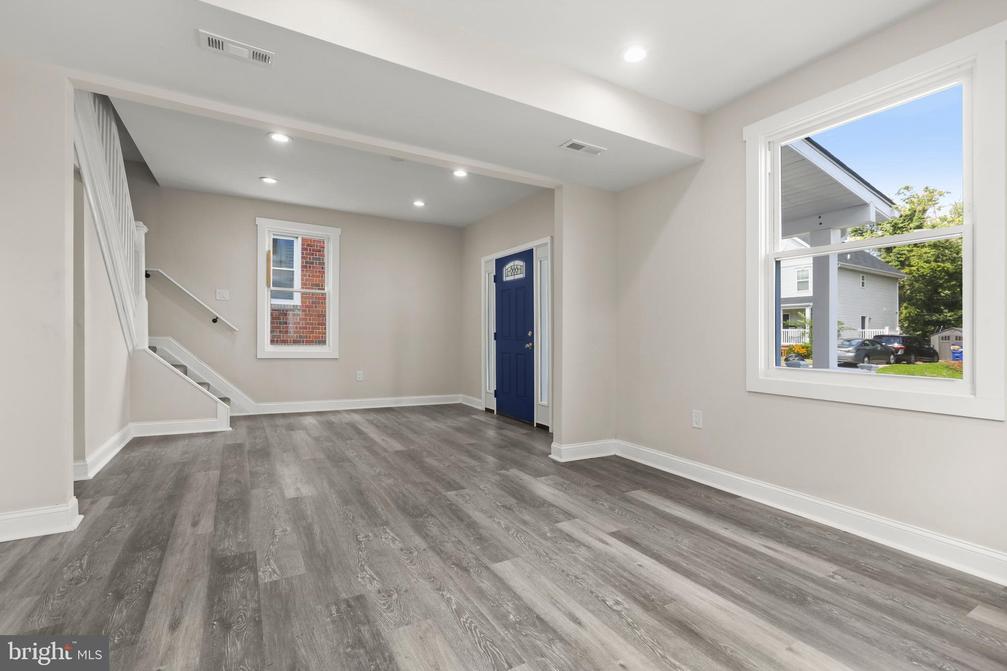 505 McCabe Avenue Baltimore, MD 21212 - Photo 9 of 46 a view of an empty room with wooden floor and a window