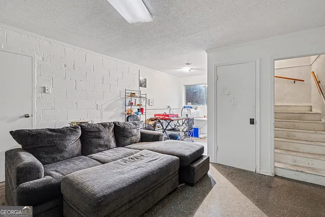 a living room with furniture and a couch
