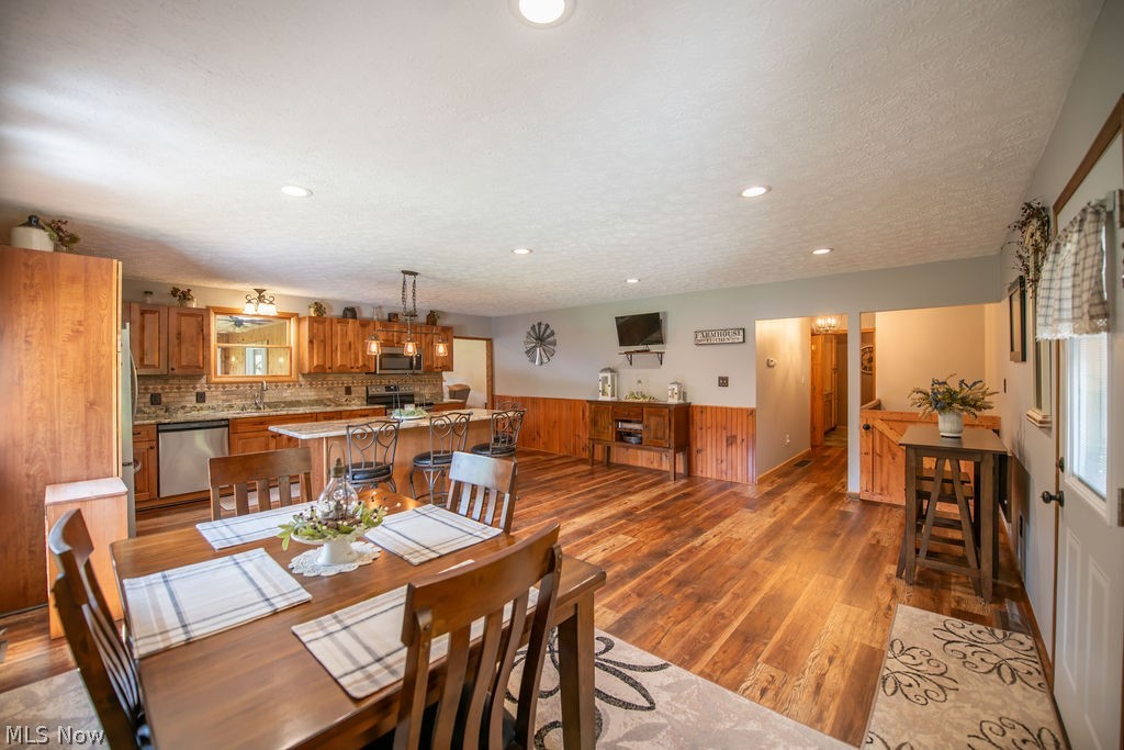 48800 Foxes Bottom Road Cadiz, OH 43907 - Photo 25 of 50 Open-concept dining and kitchen area featuring recessed lighting and a kitchen island with seating