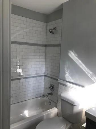 a bathroom with a shower and bathtub
