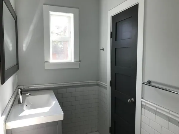 a bathroom with a sink and tub