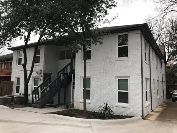 a front view of a house with stairs