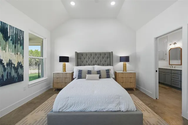 a bedroom with a large bed and a view of bedroom