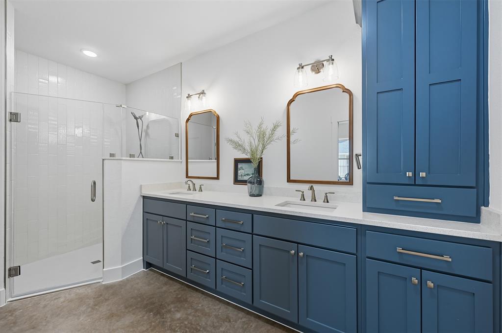104 Cardinal Wds Granbury, TX 76049 - Photo 16 of 23 Bathroom featuring double vanity and a stall shower