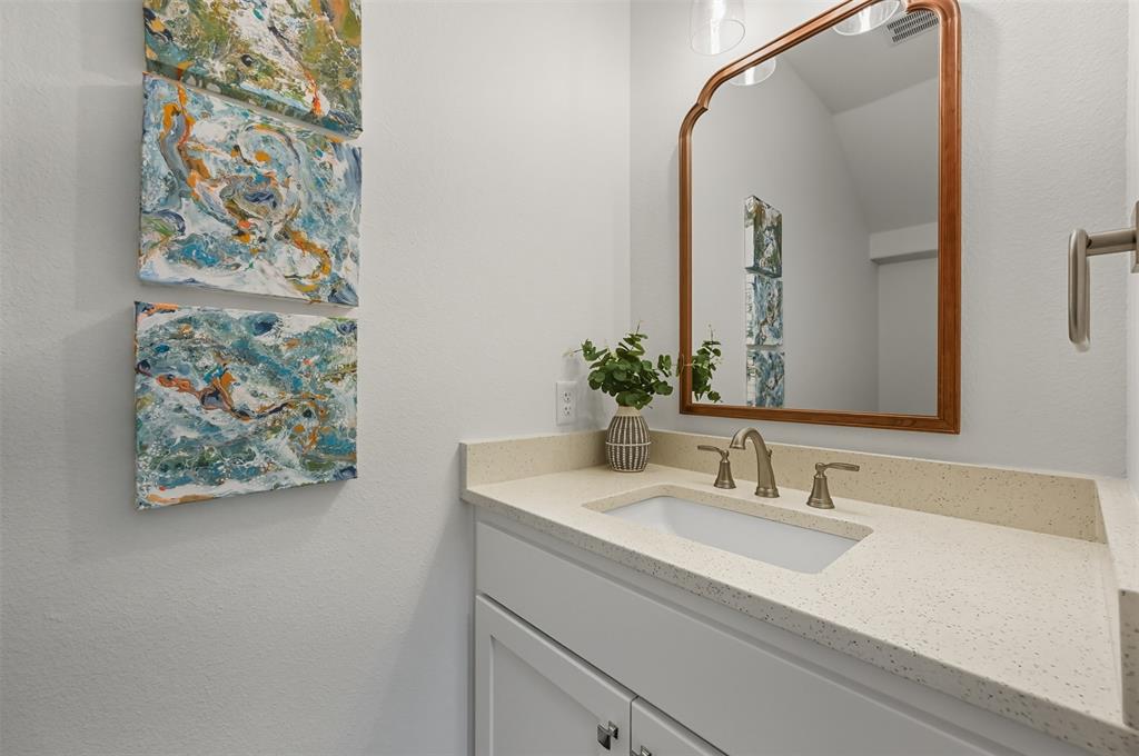 104 Cardinal Wds Granbury, TX 76049 - Photo 19 of 23 Bathroom featuring vanity and a textured wall