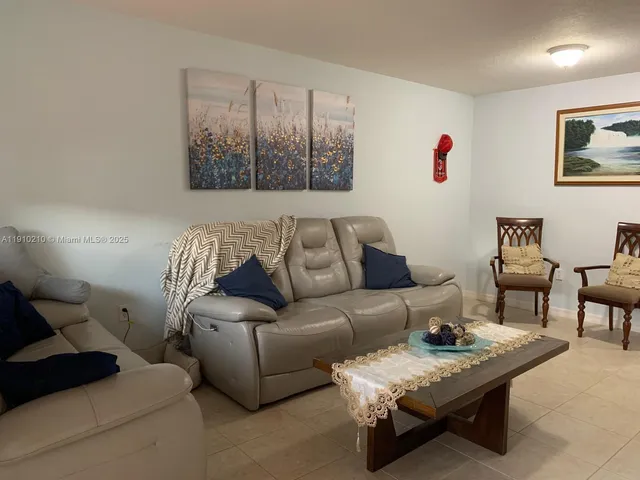 a living room with furniture and a couch