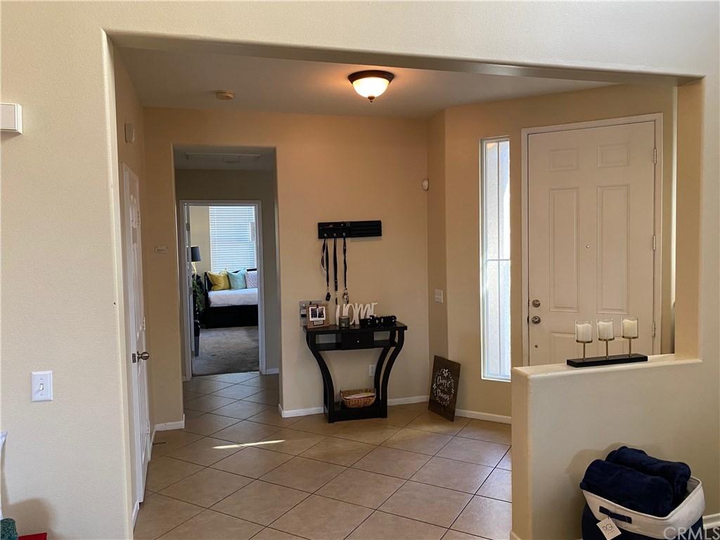 Foyer entrance and hallway to office/guest suite