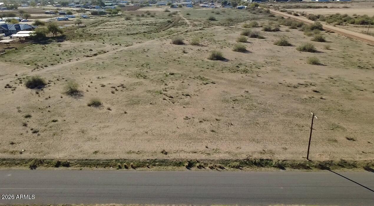 0 East Cornman Road, Unit 8 Eloy, AZ 85131 - Photo 1 of 14 a view of a dry field with trees