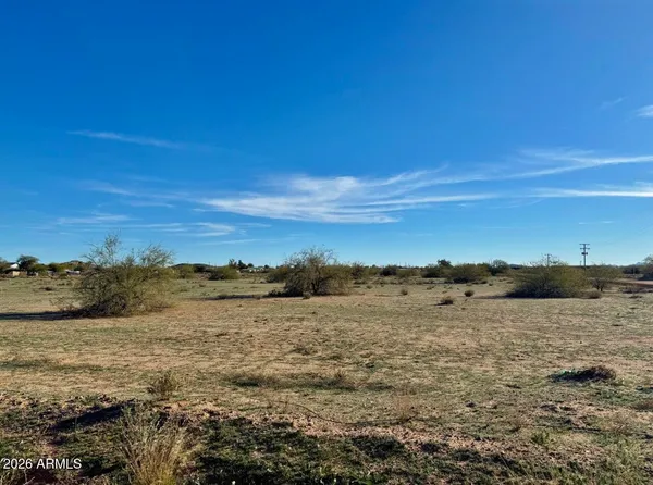 a view of a road with an ocean