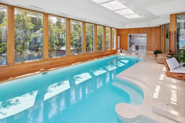 a view of a livingroom with furniture and staircase