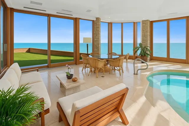 a view of a living room and a large window