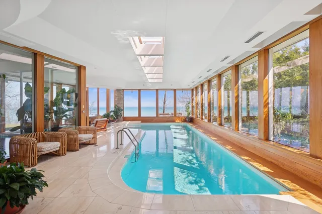a view of water heater and wooden cabinets