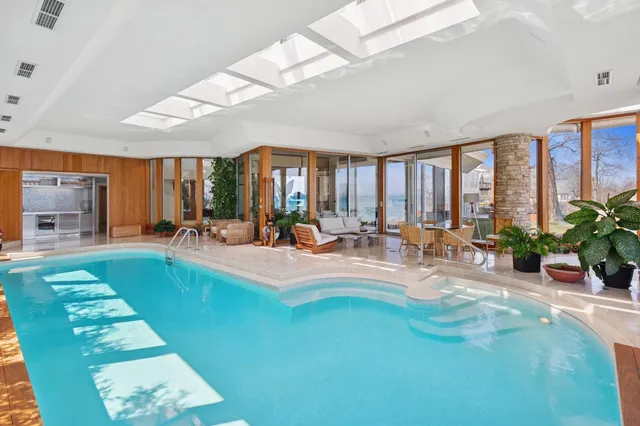 a kitchen with kitchen island a counter top space a sink and a refrigerator