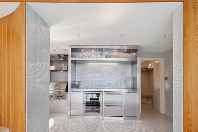 a bathroom with a sink a mirror and a bathtub
