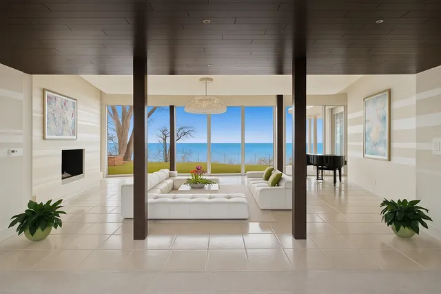 a lobby with furniture and potted plants