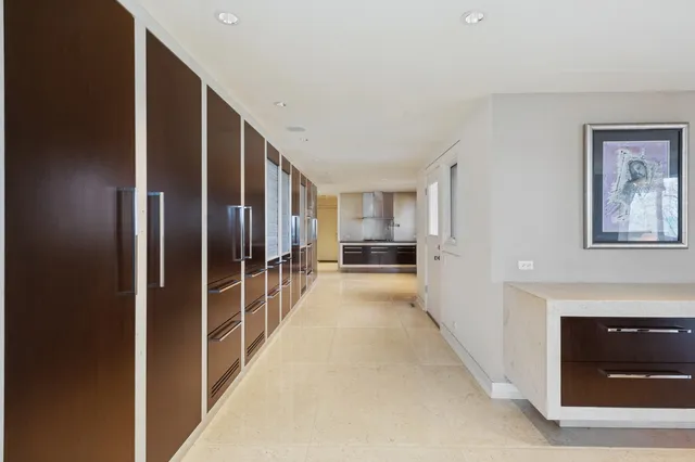 a living room with stainless steel appliances kitchen island granite countertop furniture and a kitchen view