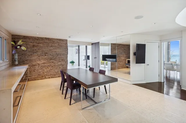 a kitchen with granite countertop a refrigerator and a sink