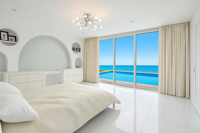 a view of a livingroom with furniture and a kitchen
