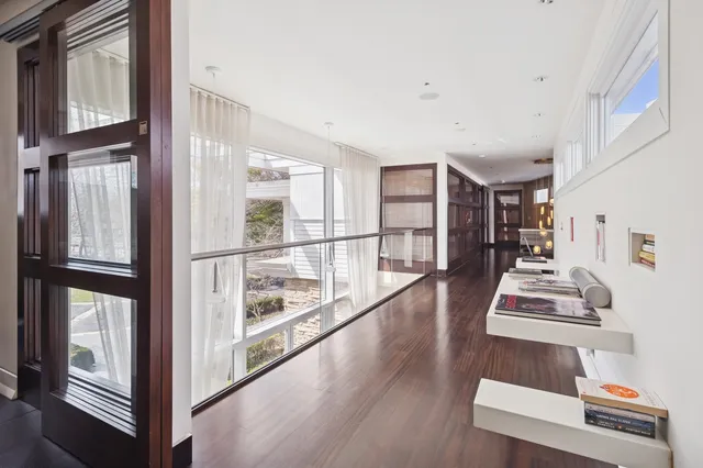 a bedroom with a large bed and a large window