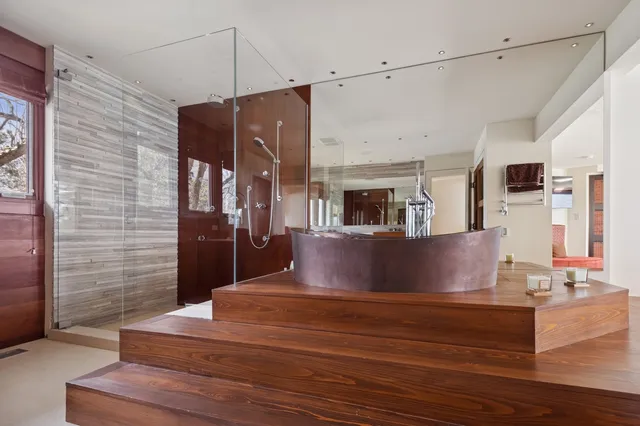 a bathroom with a toilet and a shower curtain