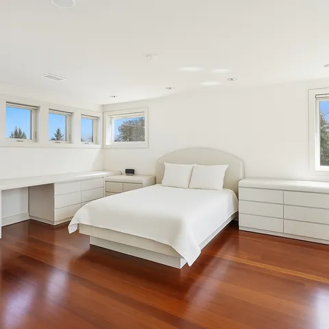 a view of an house with backyard space and balcony