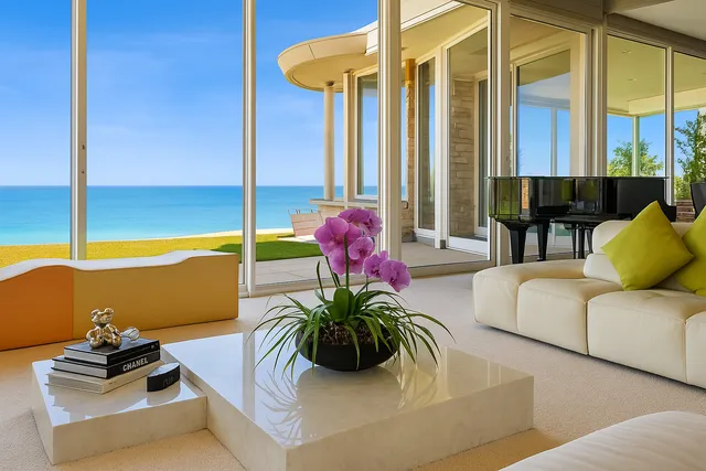 a view of a dining room with furniture a chandelier and wooden floor