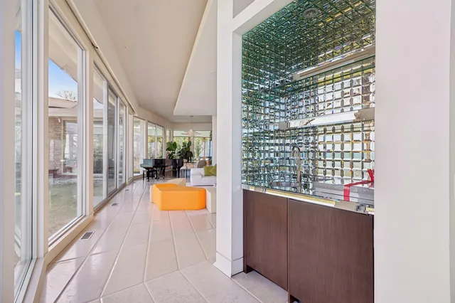 a kitchen with a table chairs stove and kitchen island