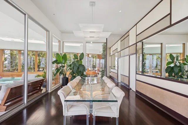 a living room with furniture and large window