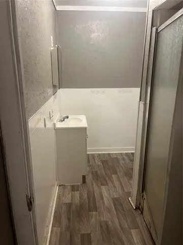 a bathroom with a sink and mirror