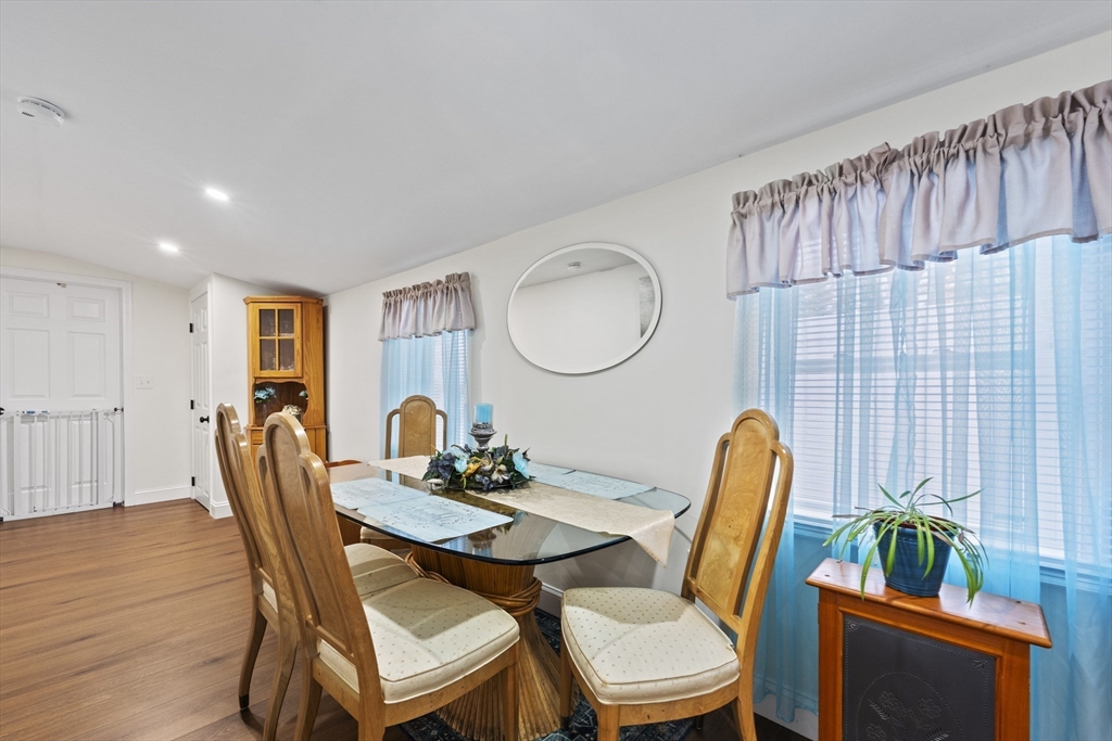 23 Bennett Lane Lancaster, MA 01523 - Photo 12 of 29 a dining room with furniture and wooden floor