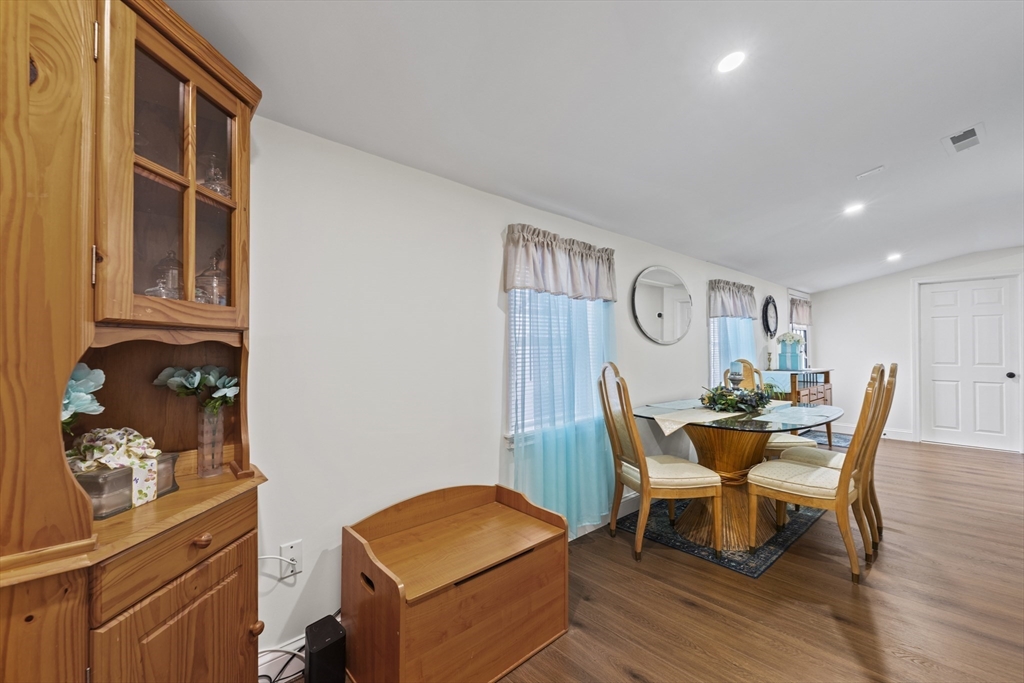 23 Bennett Lane Lancaster, MA 01523 - Photo 13 of 29 a dining room with furniture and wooden floor