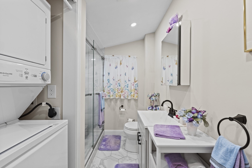 23 Bennett Lane Lancaster, MA 01523 - Photo 14 of 29 a bathroom with a tub sink and mirror