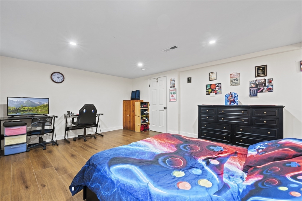 23 Bennett Lane Lancaster, MA 01523 - Photo 15 of 29 a bedroom with furniture and flat screen tv