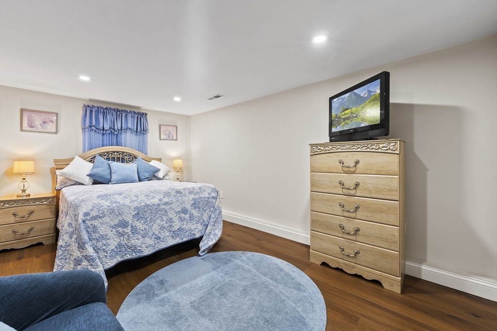 23 Bennett Lane Lancaster, MA 01523 - Photo 21 of 29 a bedroom with a bed and furniture