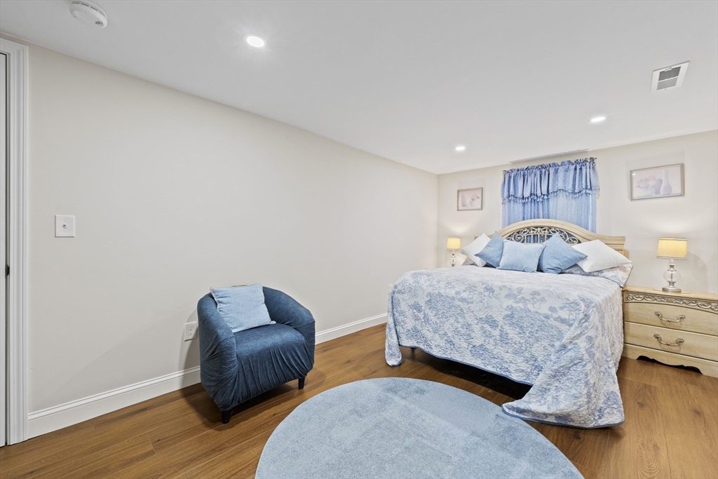 23 Bennett Lane Lancaster, MA 01523 - Photo 22 of 29 a bedroom with two beds and a couch