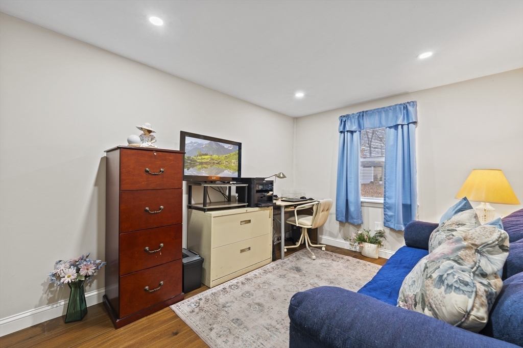 23 Bennett Lane Lancaster, MA 01523 - Photo 24 of 29 a bed room with a bed and a television