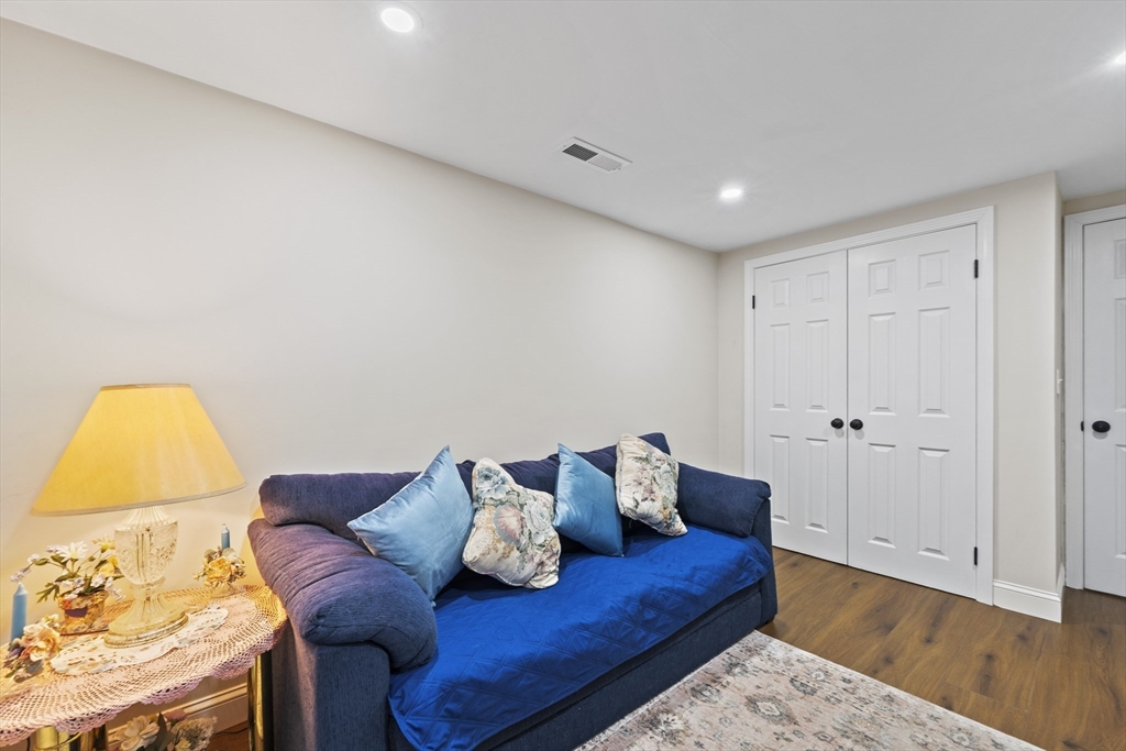 23 Bennett Lane Lancaster, MA 01523 - Photo 25 of 29 a living room with furniture and wooden floor