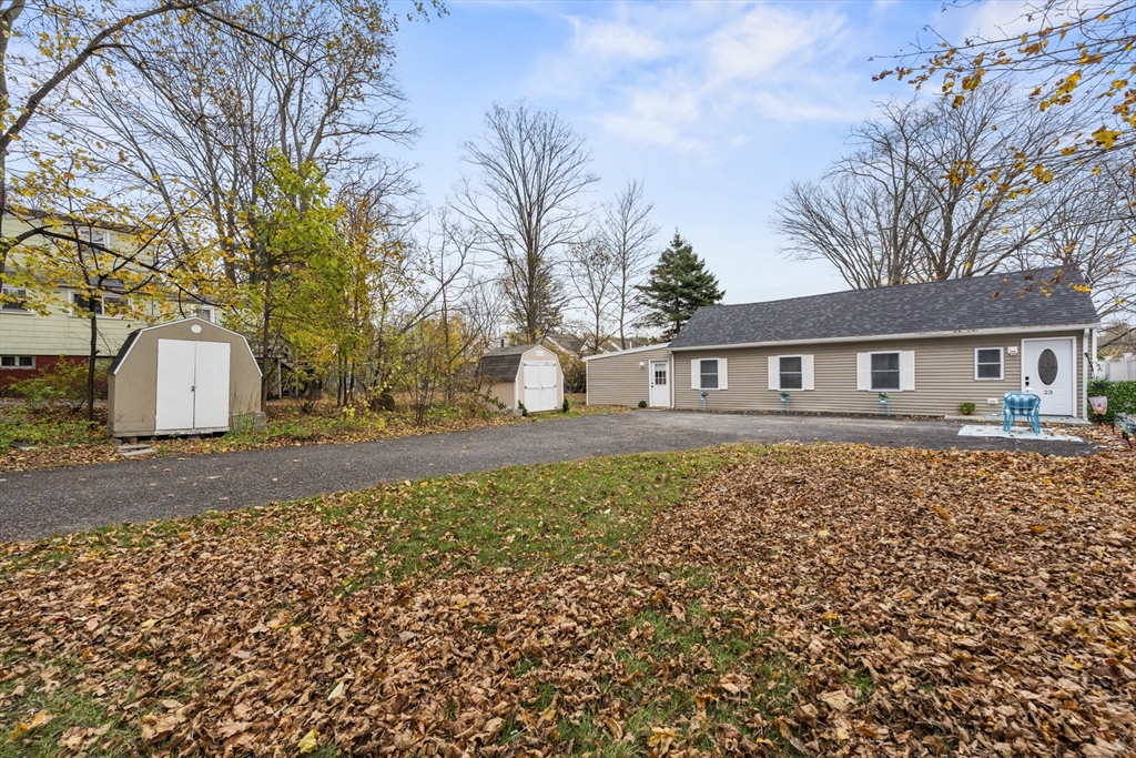 23 Bennett Lane Lancaster, MA 01523 - Photo 28 of 29 a front view of a house with a yard