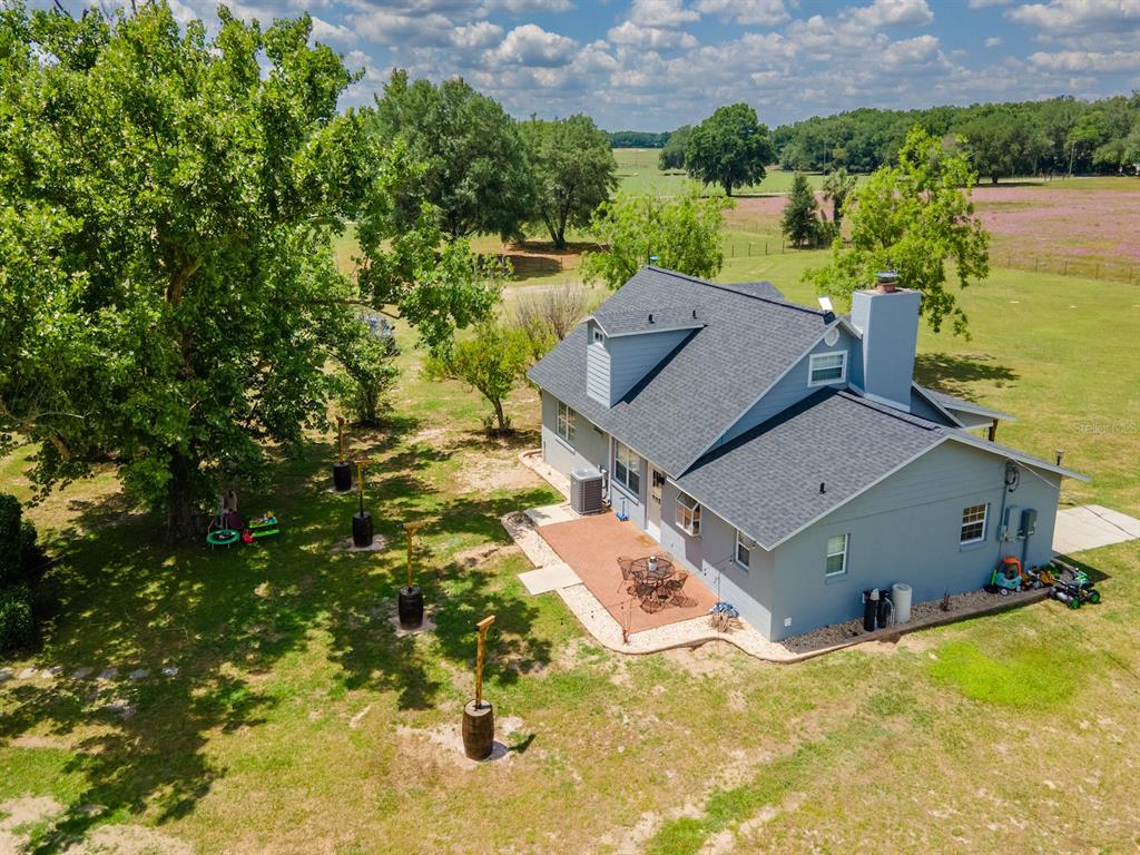 4381 Northeast 105th Place Anthony, FL 32617 - Photo 48 of 49 an aerial view of a house with a yard