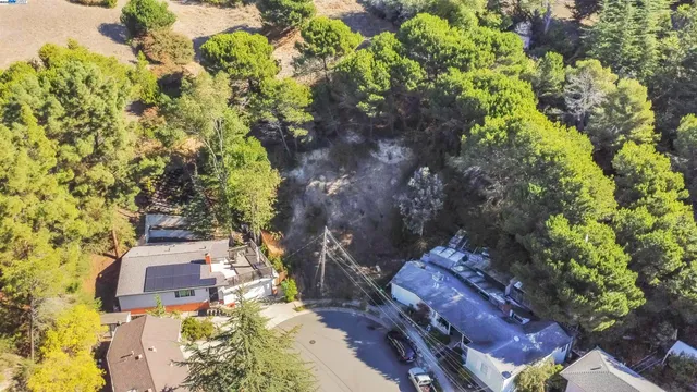 a aerial view of a house with a yard and garden